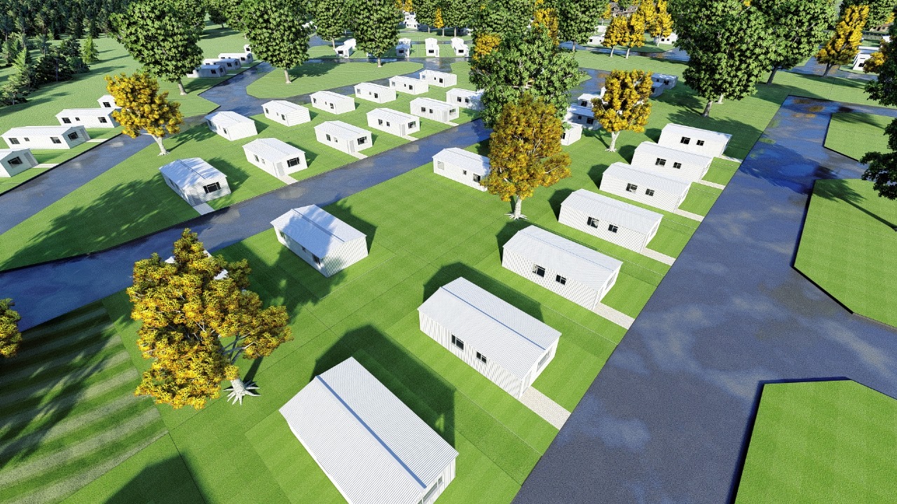 Aerial view of light-coloured starter homes and green spaces